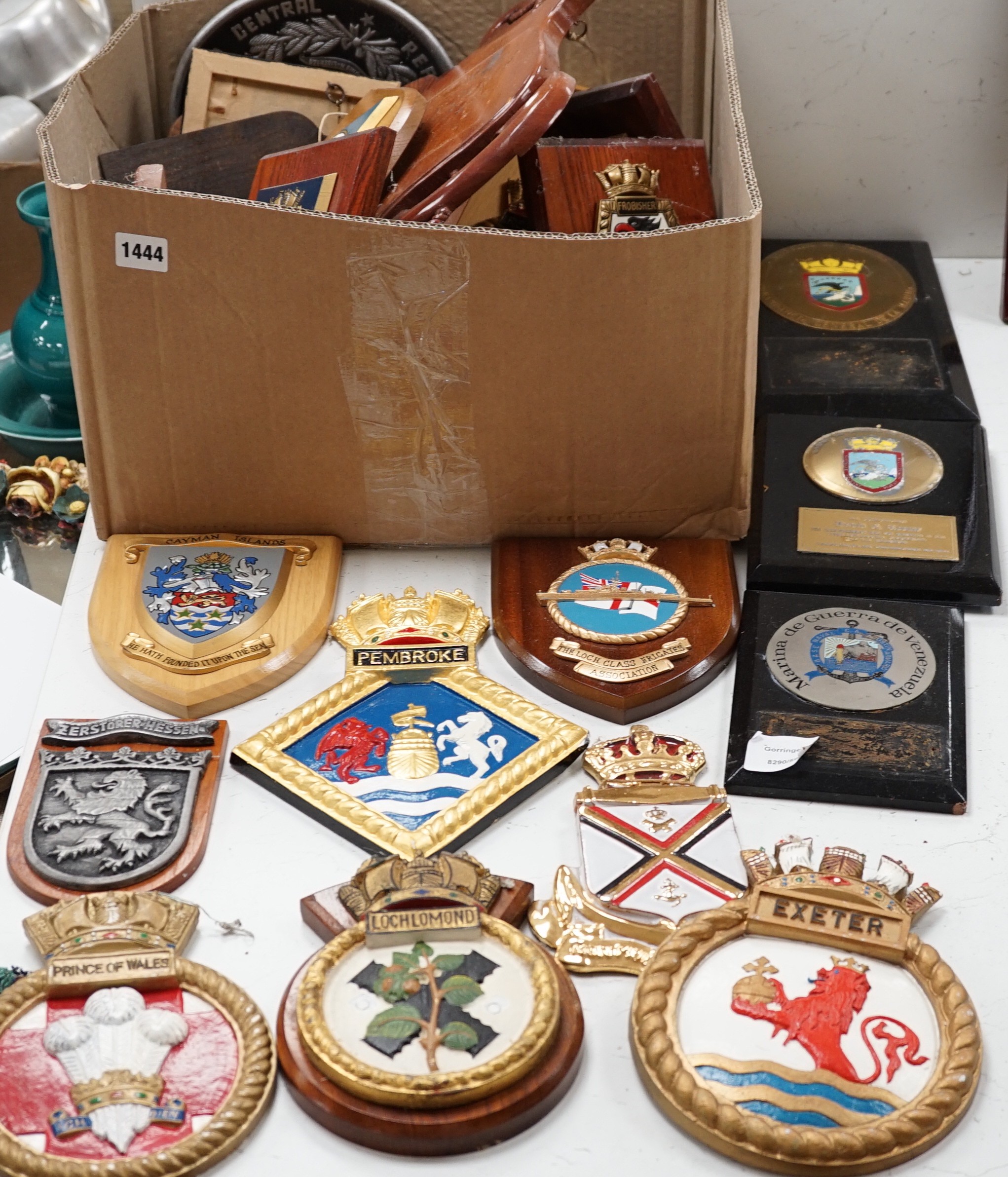 A collection of approximately twenty five plaster and other naval / military and Royal wall hanging plaques